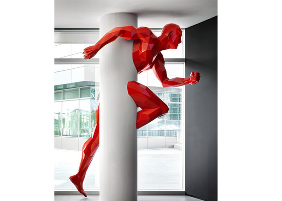 Chiny Duża malowana nowoczesna sztuka geometryczna Runing Man Dekoracja ścienna z włókna szklanego Rzeźba dostawca